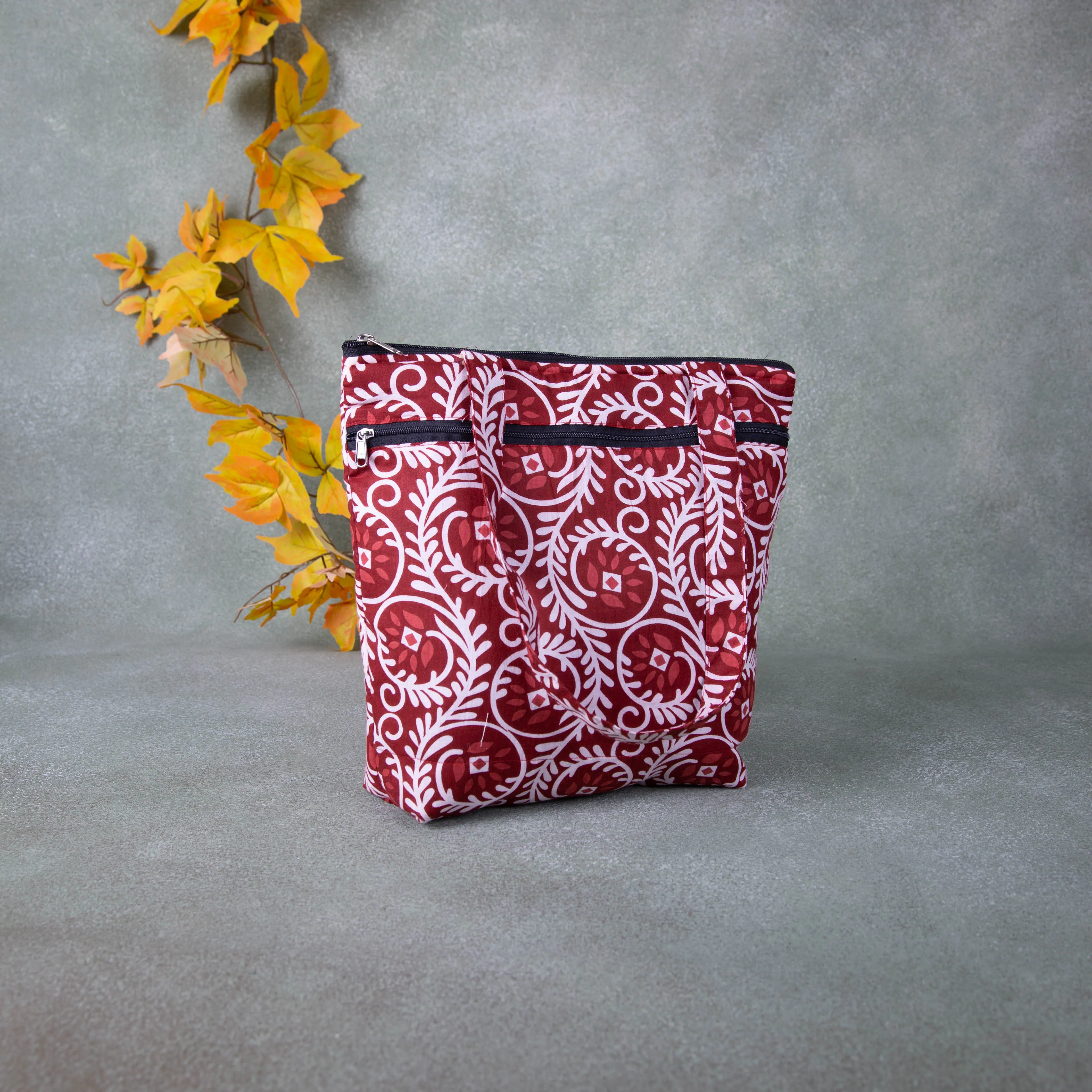 Medium Size Handbag Maroon with White Prints.